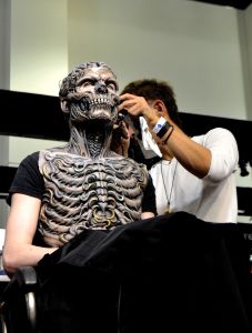 Makeup artist works on his project - Photo by Craig Hammons